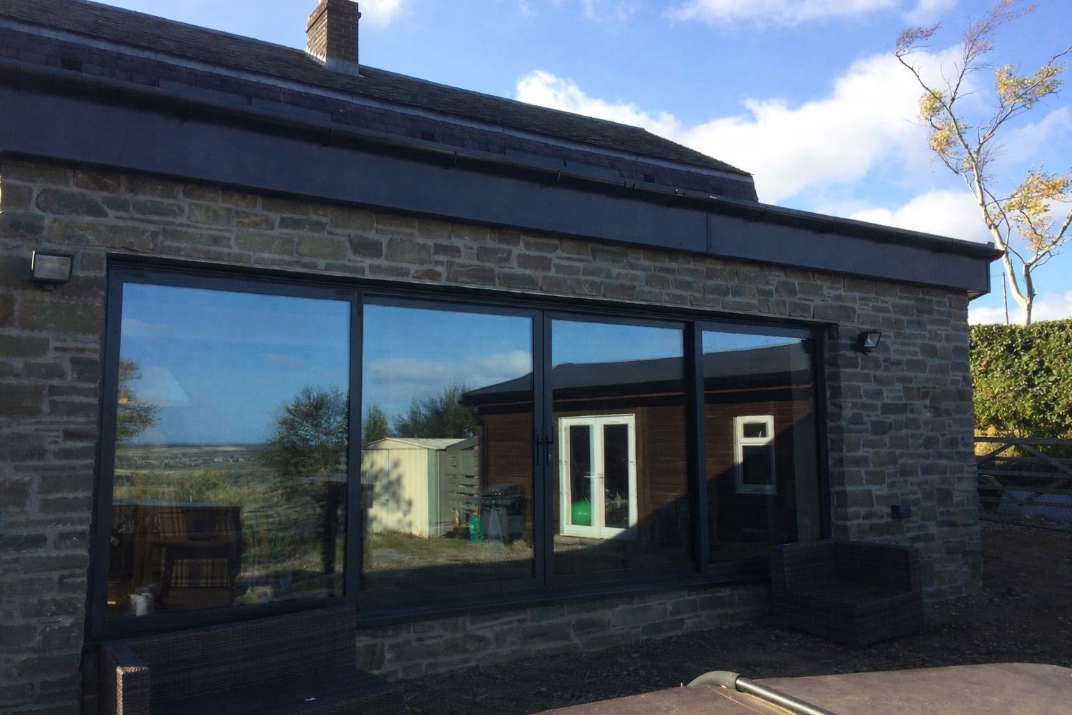 Modern single-storey house extension with bi-fold doors in Perthshire
